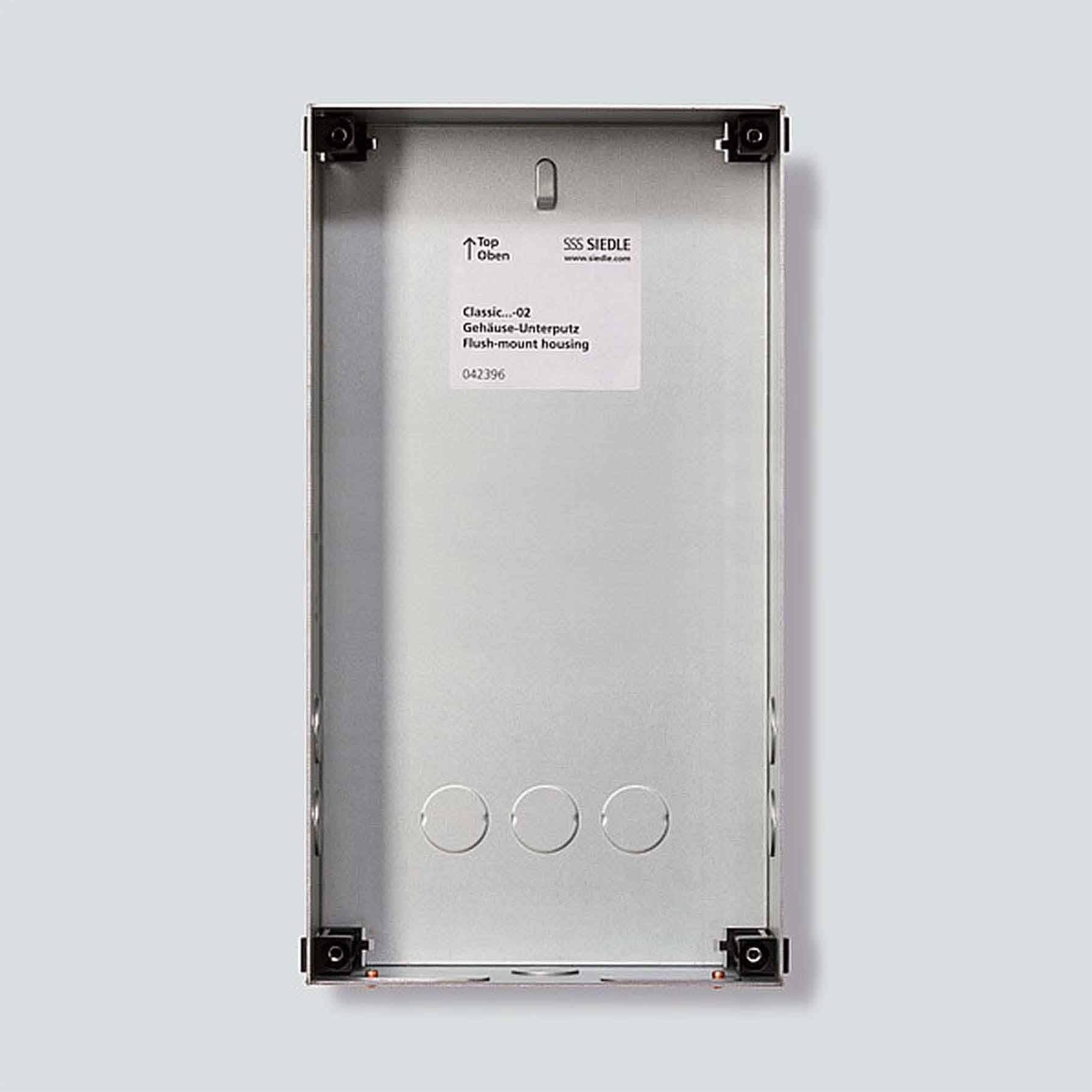 Housing for an SSS Siedle switch, with space for three round push buttons. Marked 'Top' and 'Oben' at the top.