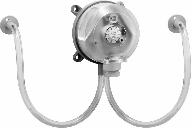 Metallic pressure gauge with two curved connecting hoses, used for measuring gas pressure in industrial applications.