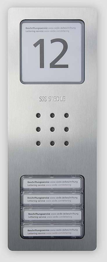 Intercom system with number '12', microphone, speaker and four illuminated doorbell plates on a stainless steel panel.
