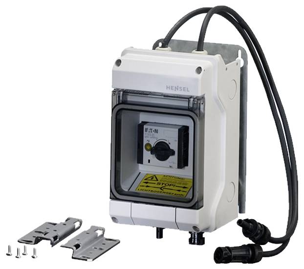 An electrical control cabinet with 'EATON' labelling. Contains a switch, cable connections, mounting hardware, and a protective enclosure.