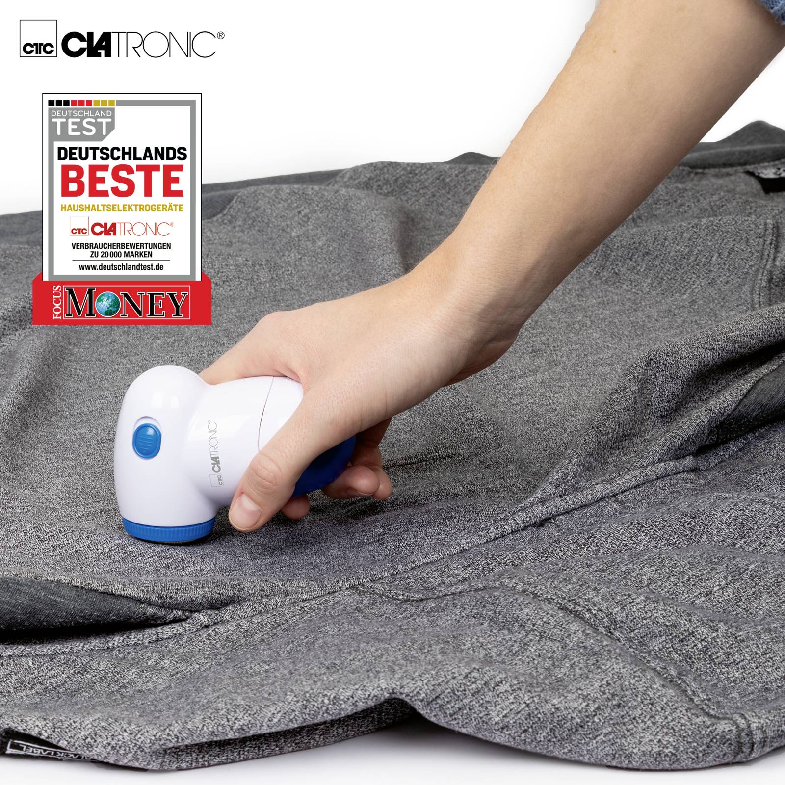 A hand holds an electric lint remover and removes lint from a grey fabric. A seal shows 'Germany's Best'.