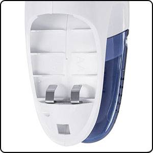 Electric steam iron with a transparent water tank, showing the soleplate with steam outlet holes and power connection.