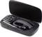 Black Bluetooth headset with charging station and spare earbuds in an open case.