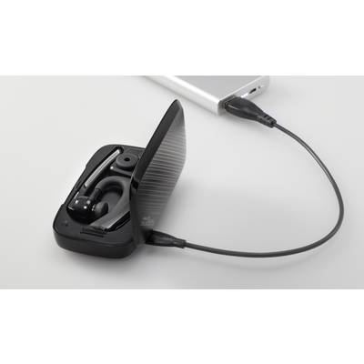 Open charging case with a wireless earbud, connected to a charging cable plugged into a separate power source.