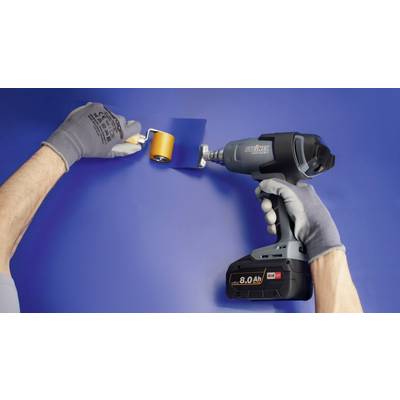 'A person is using an electric device to attach a blue wallpaper to the wall. On the left, a hand with a roller tool is visible.'