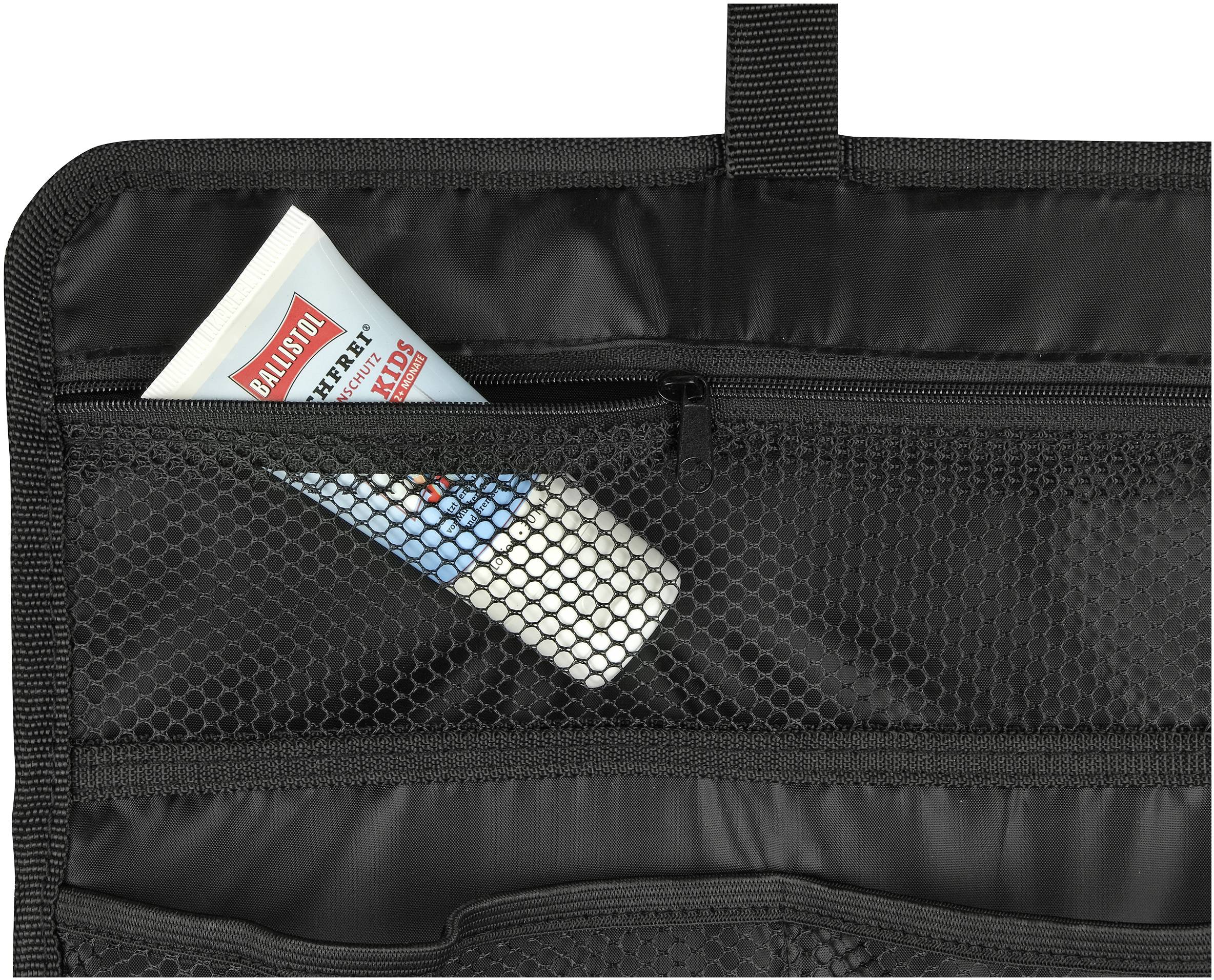 Bottle and tube in a black mesh bag of a travel organiser.