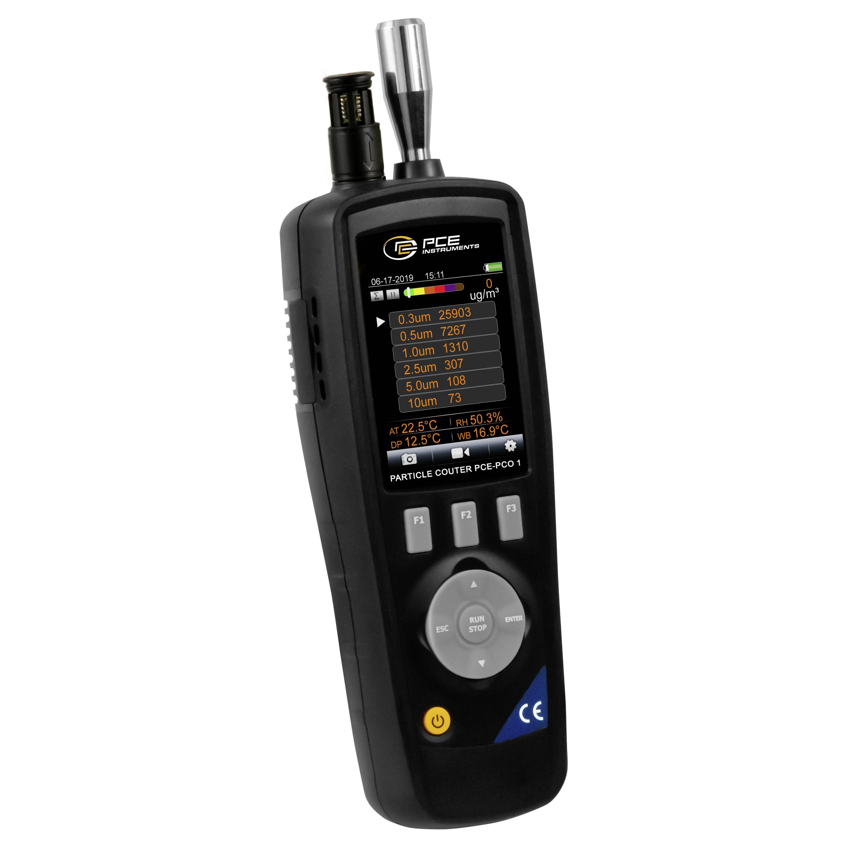 Handheld PCE particle counter air quality meter showing particle counts, temperature, and humidity on its display.