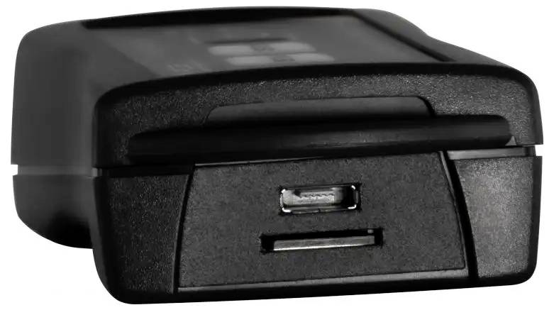 A black electronic device with a USB port on the side, possibly a charger or power bank, shown from a side angle.