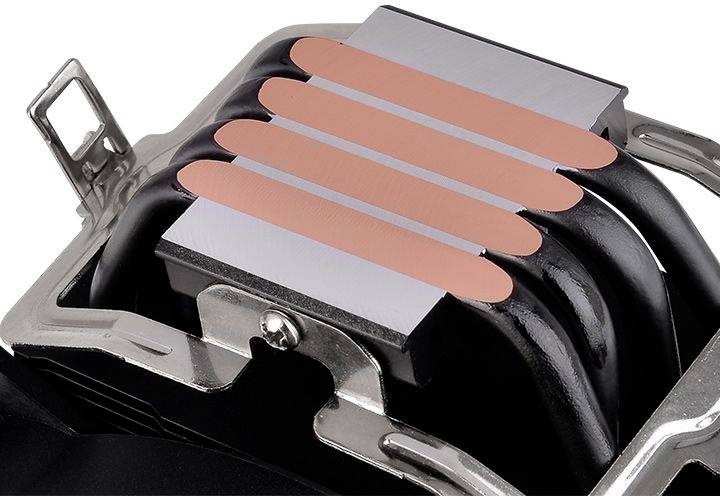 Cooler with cylindrical heat pipes touching copper fins, designed for efficient heat dissipation, mounted on a metal carrier.