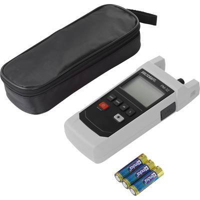 A digital measuring device with a display, three buttons and two ports lies beside a black bag and three supplied batteries.