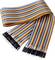 Flat ribbon cable with colourful stripes and connectors at both ends, suitable for electronic projects and circuits.