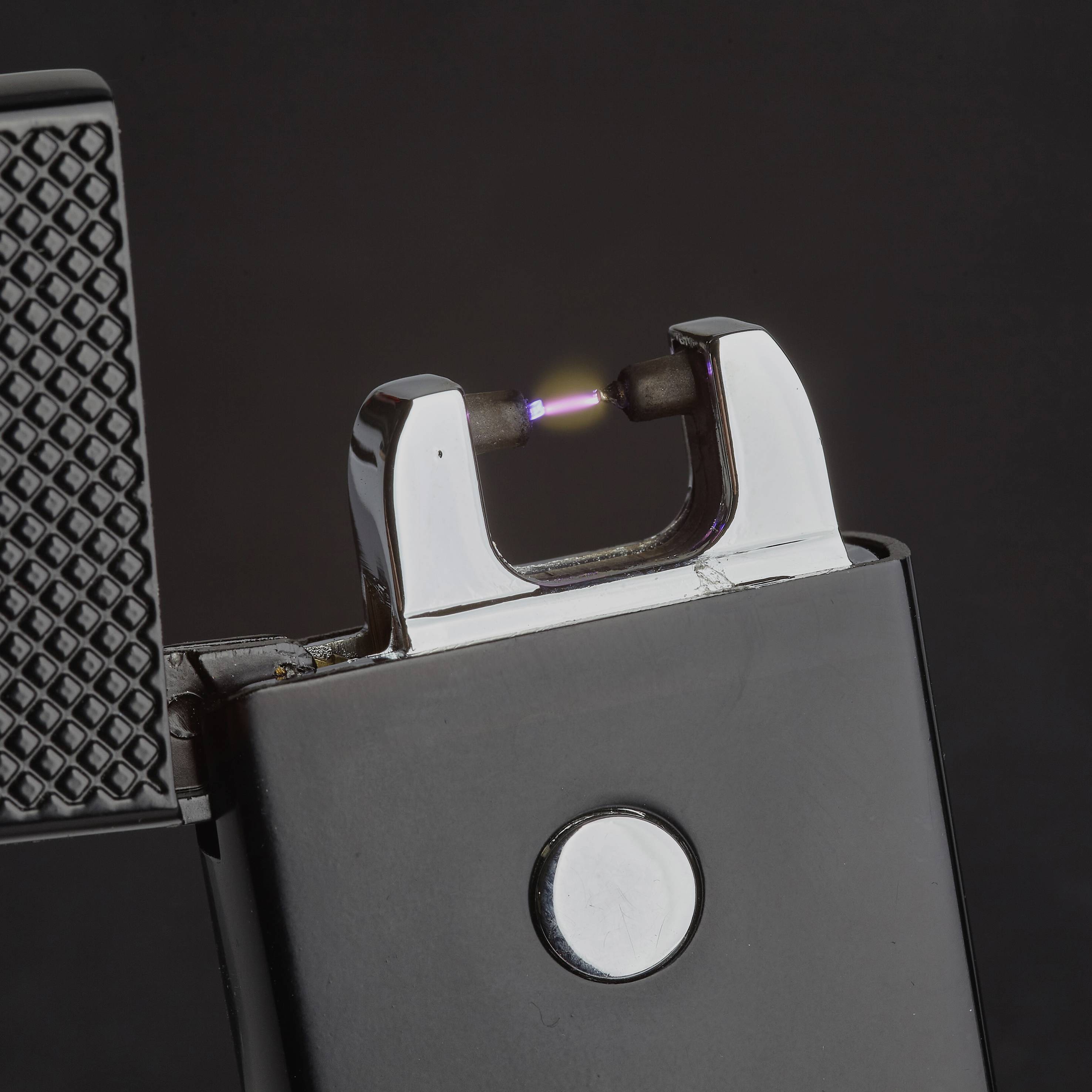 An electric lighter with a blue plasma arc, ready to ignite. The lighter is half-open and dark in colour.
