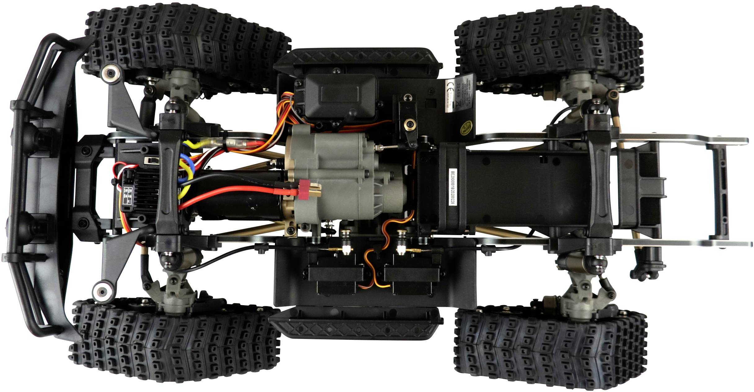 'Top-down view of a remote-controlled off-road vehicle without bodywork, showing wiring, motors and suspension.'