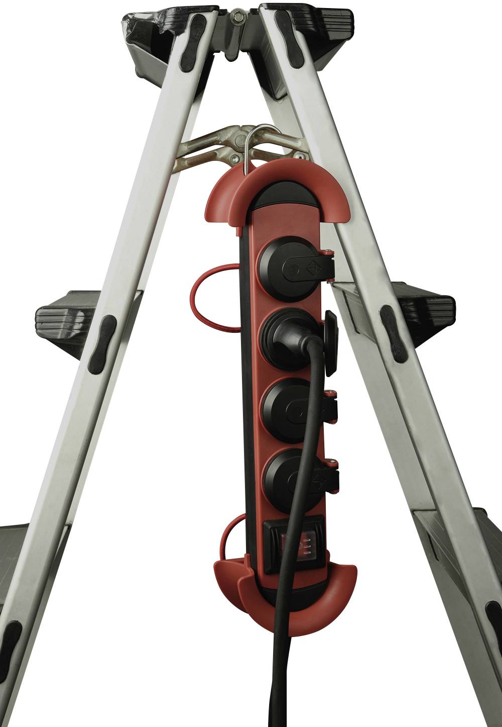 A red extension socket with multiple cables hangs between the legs of a metal ladder.