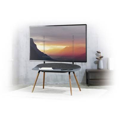 A living room with a modern television displaying a mountain landscape at sunset, and a stylish black table in front of it.