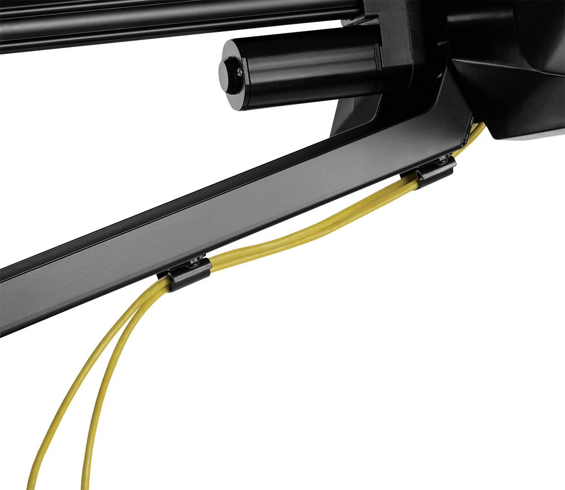Close-up of a black fitness equipment with yellow cable pulls, showing the attachment and tension of the cables for strength training.
