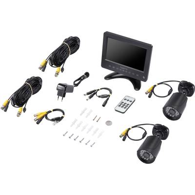 Surveillance camera kit with monitor, two cameras, cables, remote control, and accessories. Ideal for security monitoring of buildings.