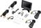 Surveillance camera kit with monitor, two cameras, cables, remote control, and accessories. Ideal for security monitoring of buildings.
