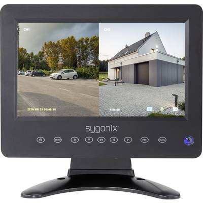 A surveillance monitor displays two camera images: on the left, a car park with several vehicles, on the right, a modern house at dusk.
