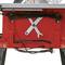 Red table saw with visible saw blade, mounted spanner, and cable with plug underneath.