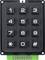 A numeric keypad with keys from 0 to 9 and star and hash symbols, mounted on a green electronic circuit board.