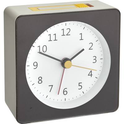 A square mantel clock with a black frame and white dial shows 10:10. The clock has black hour and minute hands and a yellow second hand.