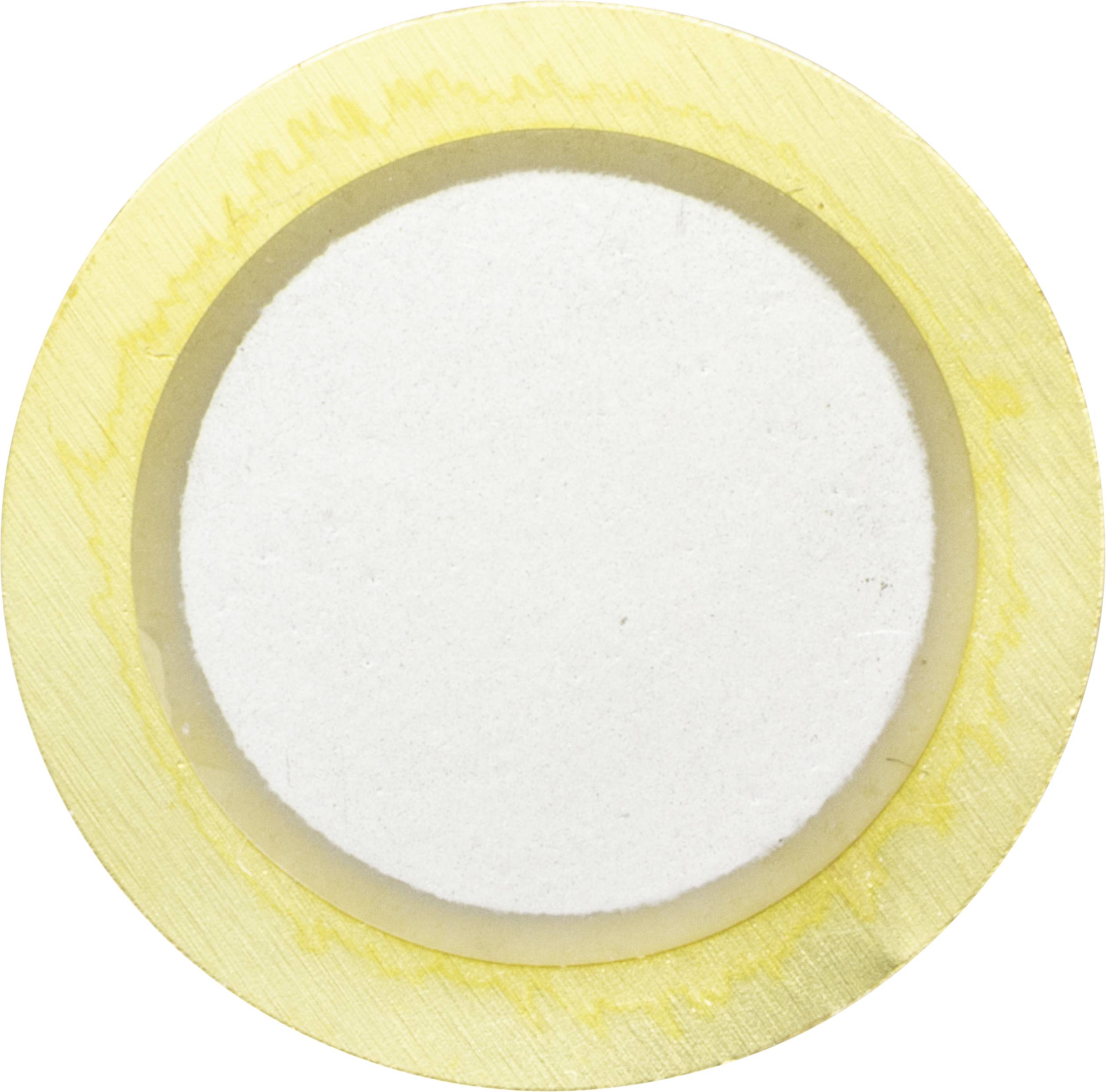 A circular surface with a white centre and a yellow border.