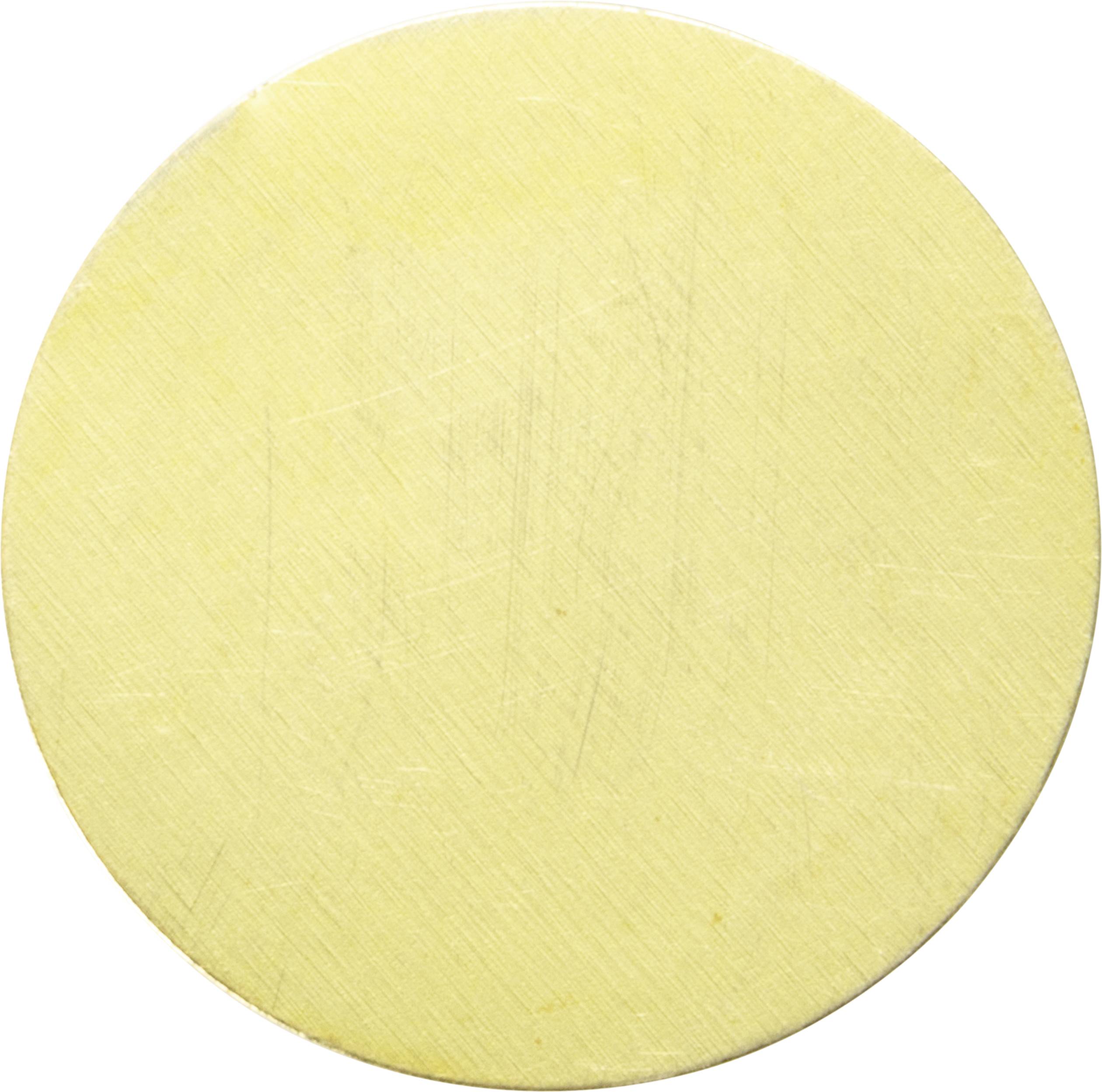 A circular, slightly textured, beige object against a white background.