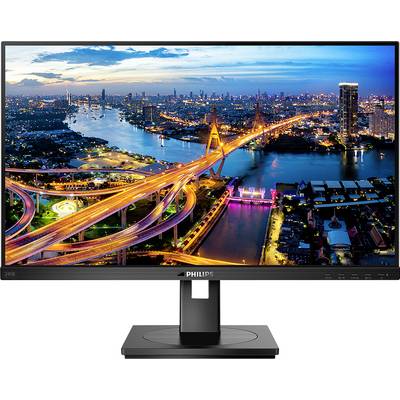 View of a nighttime city with illuminated bridges and rivers displayed on a Philips monitor.