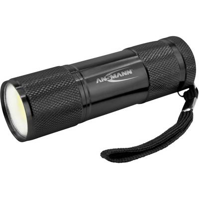 Black torch with textured grip and wrist lanyard, branded with the 'ANSMANN' logo on the side.