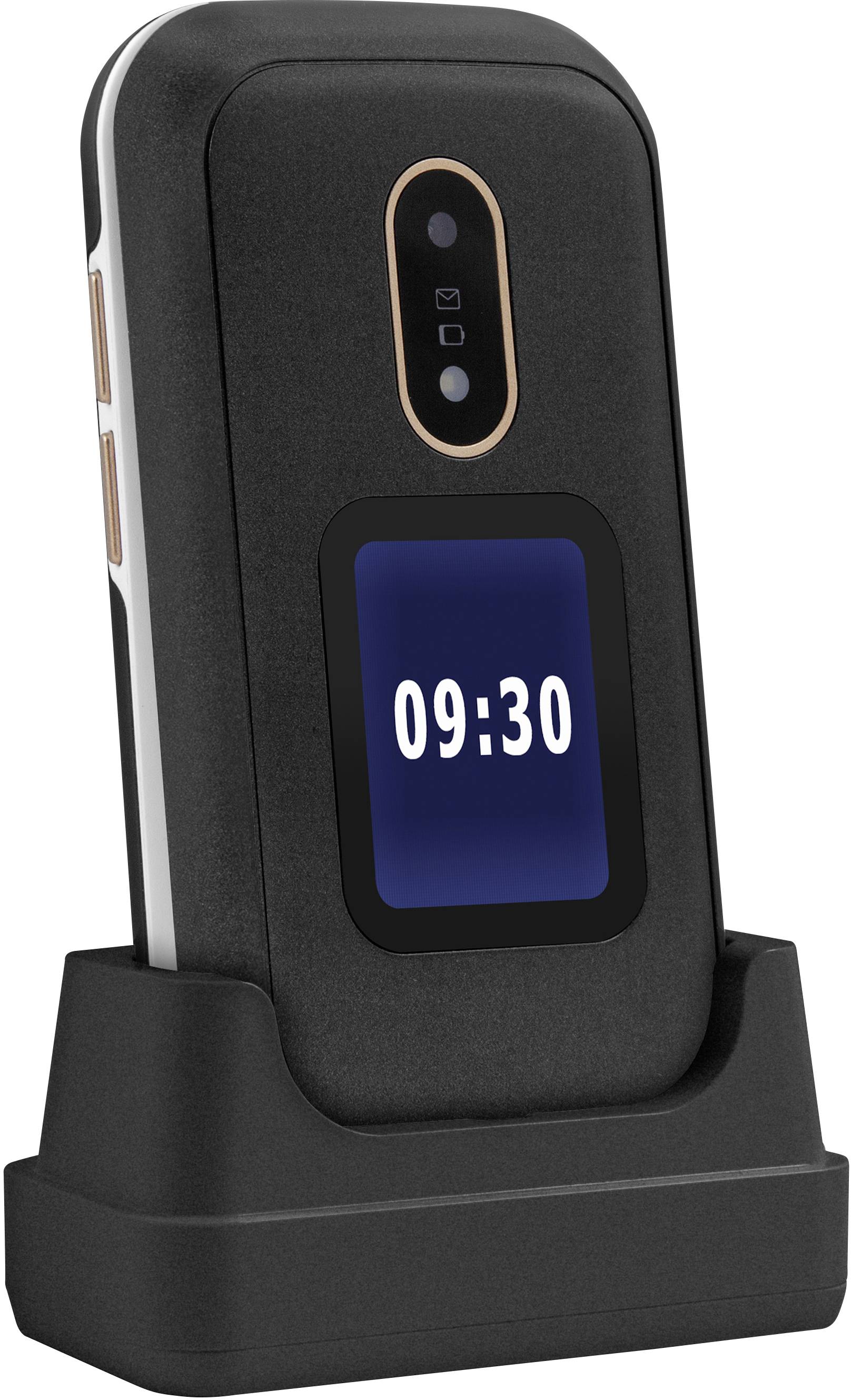 A vertically standing flip phone in a charging dock. The display shows '09:30'.