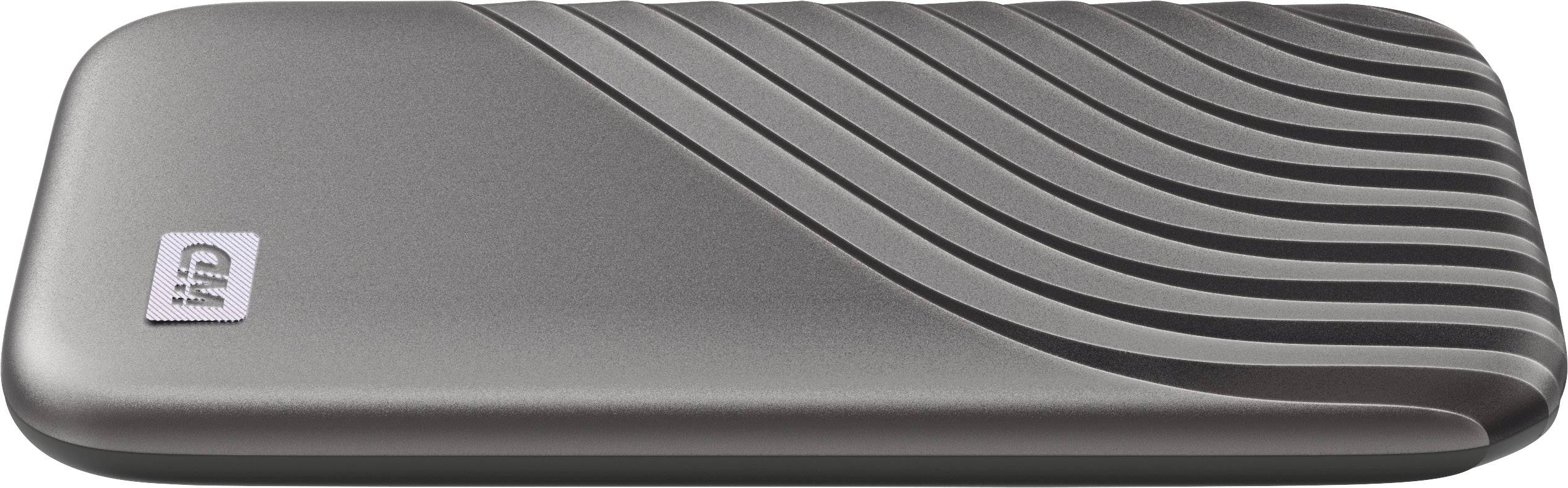 External hard drive in grey with a wave-like design pattern and 'WD' logo on the surface.