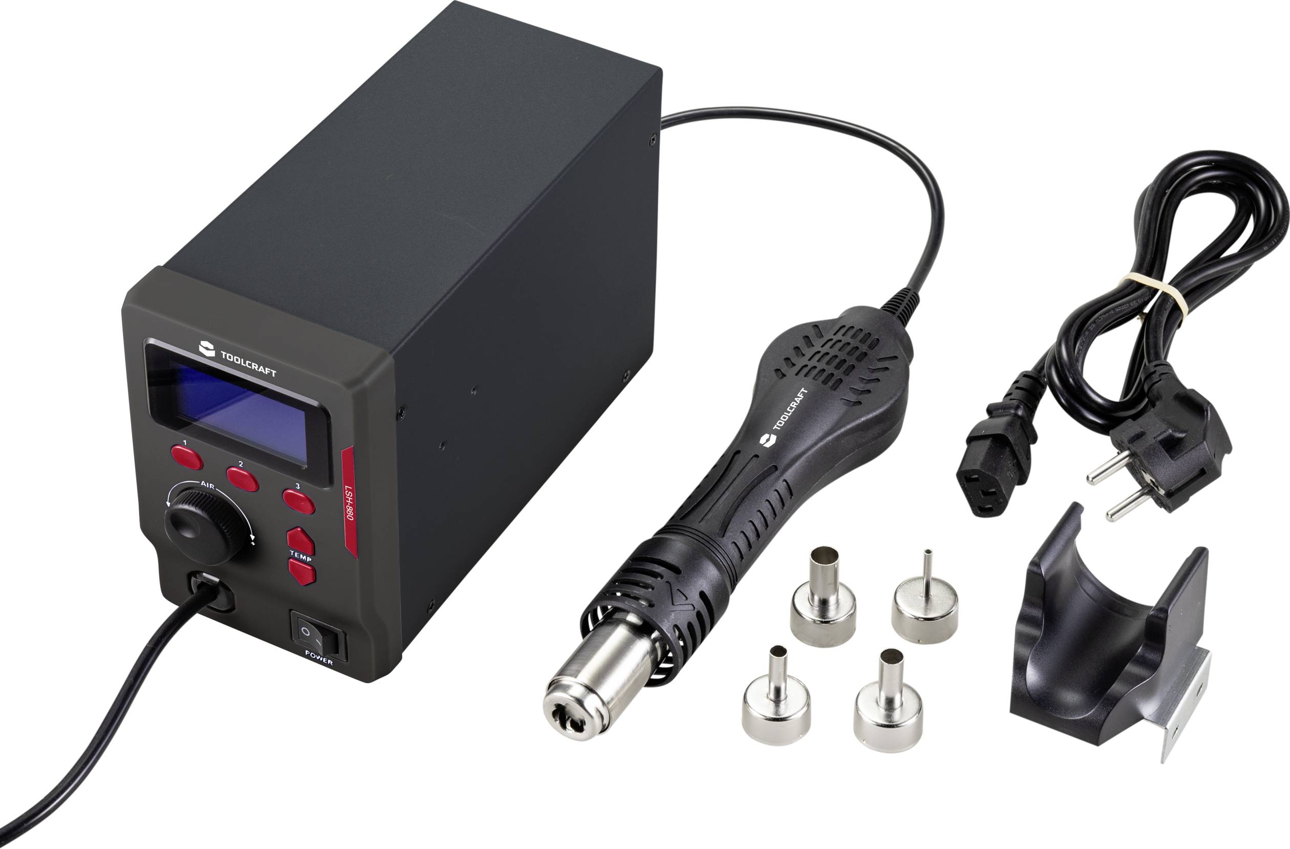 A hot air soldering station with a digital display and controls, surrounded by various nozzle attachments and a power cable.