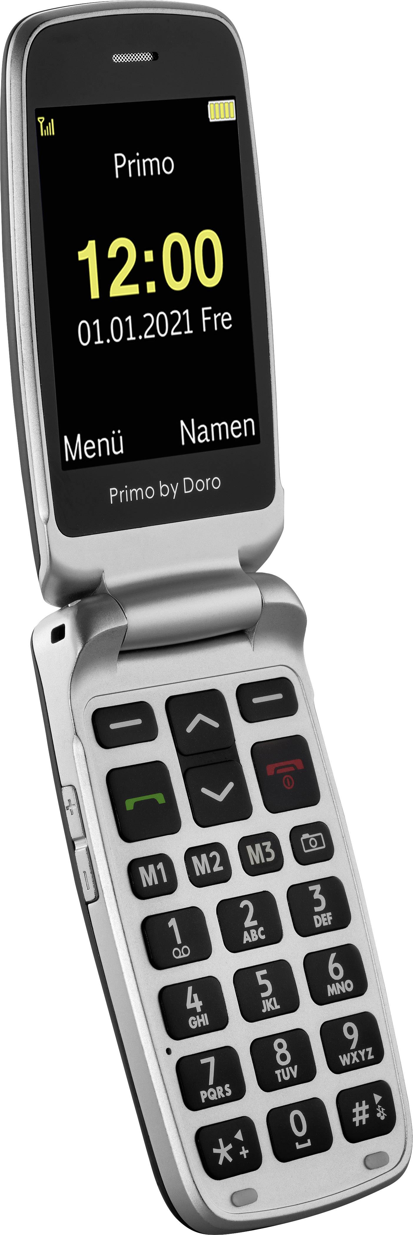 A silver flip mobile phone displays the time and date on the screen '12:00 01.01.2021 Fri'. Large buttons and a display with big digits.