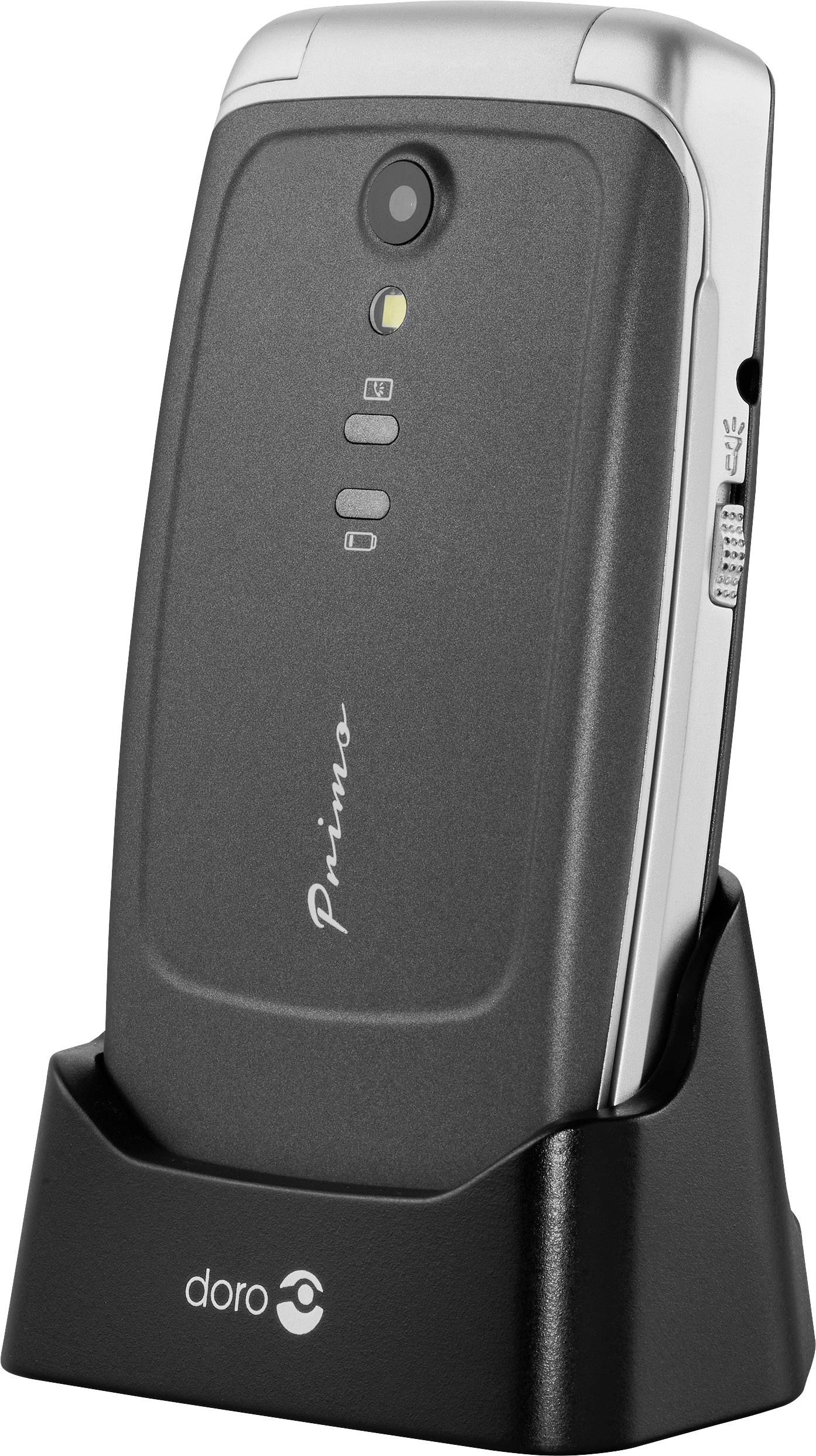 A black flip mobile phone from 'Doro' is sitting in a charging station. It has a camera and large buttons.