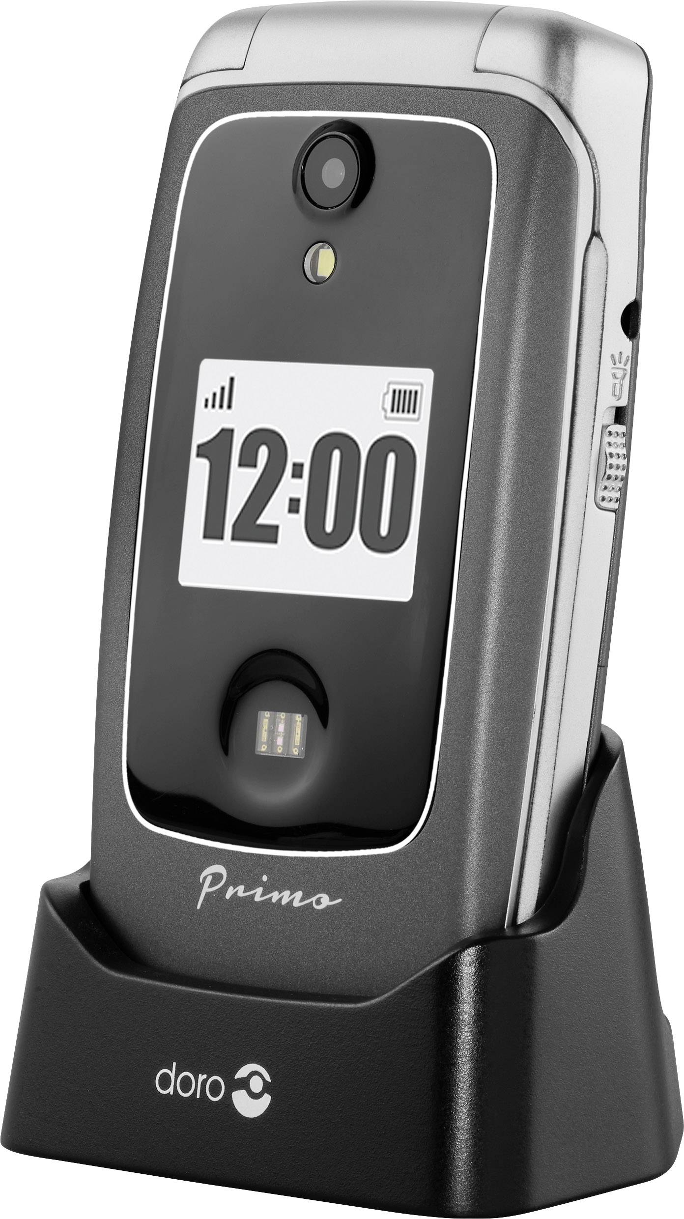 A black folding mobile phone by the brand 'doro' is standing in a charging station. The display shows the time as 12:00.