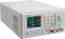 A digital DC power supply displays multiple adjustable output values on a colour screen, with a keypad for control.