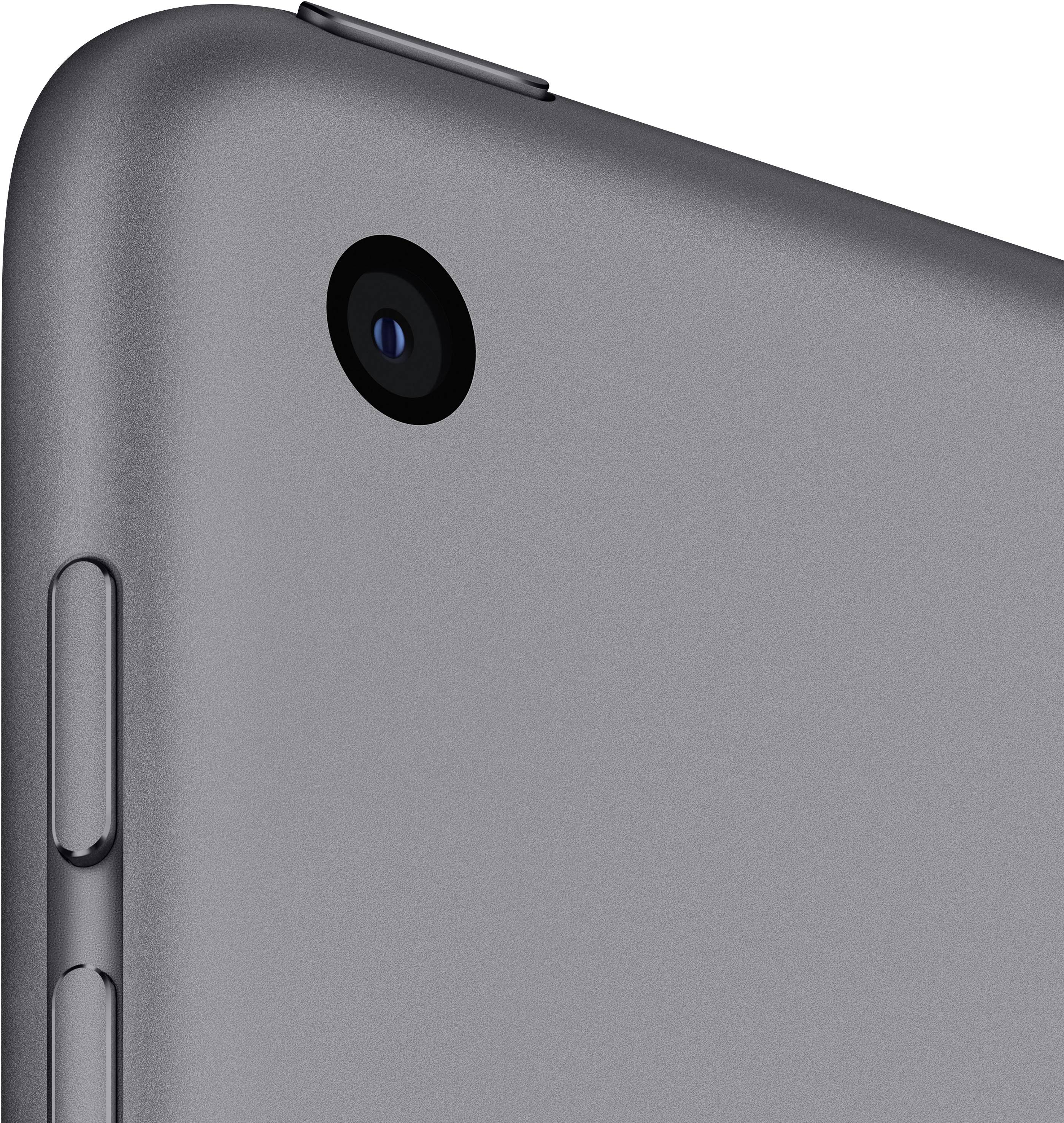 Close-up of tablet rear with camera lens and volume controls on grey casing.