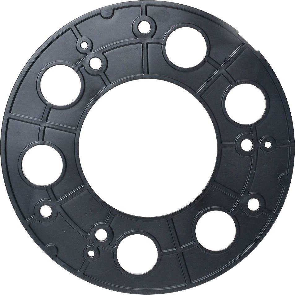 Black plastic disc with multiple circular holes of varying sizes, potentially part of a machine or device.