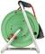 Green cable reel with metal frame, black handle on top, red cable. Used for electrical distribution in locations without fixed power sockets.