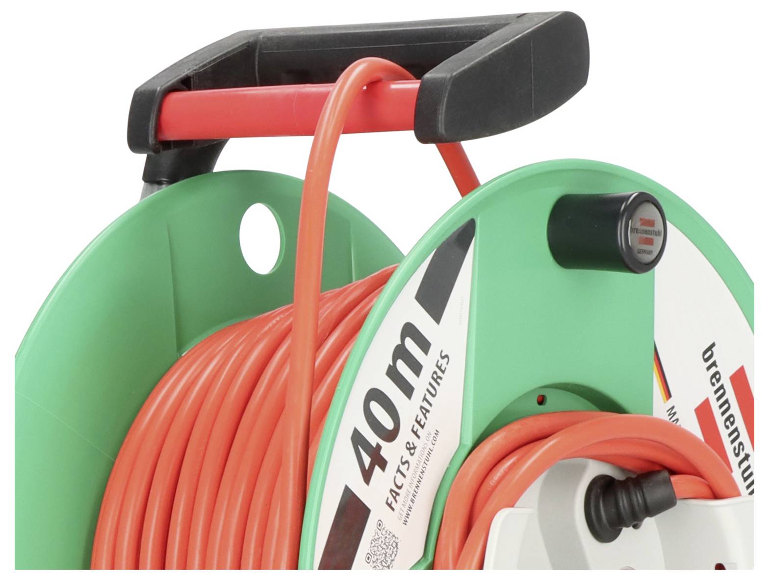 Close-up of a green and black hose reel cart with a red hose coiled on it.