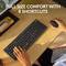 A person is using a wireless keyboard and mouse on a wooden table. Text in the image: 'Comfort in standard size with 8 shortcuts'.