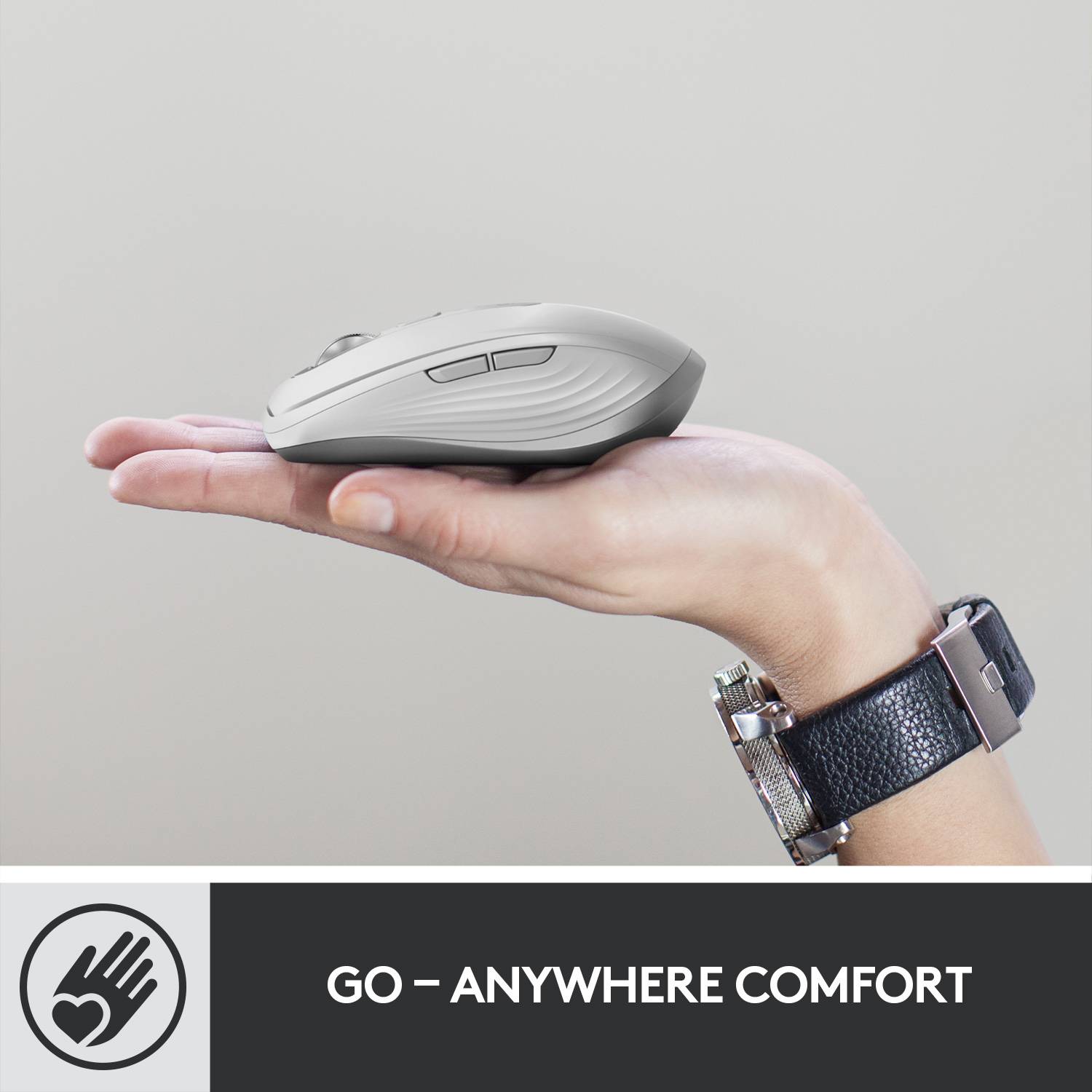 A hand holding a computer mouse; underneath the text 'Comfort everywhere'. Outside the image is a logo of a hand with a heart.