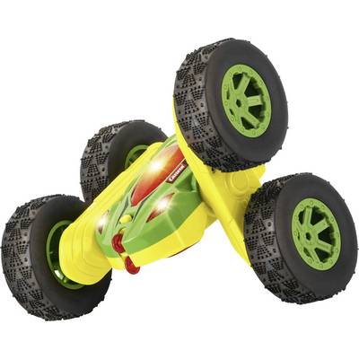 A colourful toy car with large, robust tyres, lying on its side. It has lights on the top surface.