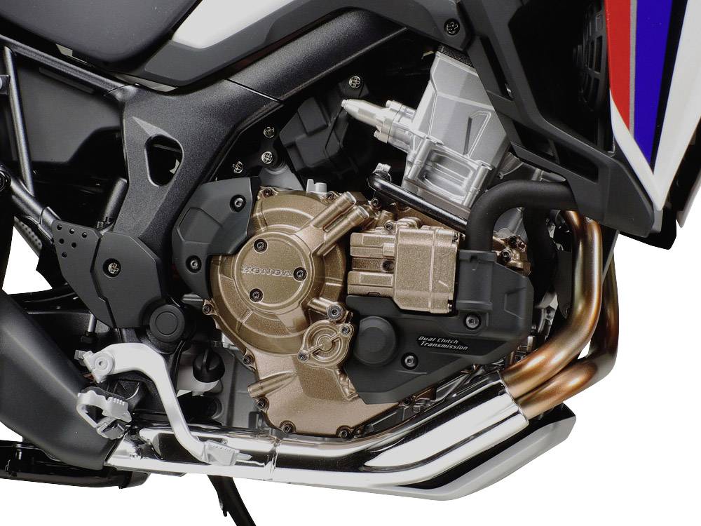 A motorbike with a detailed image of the engine and exhaust system, showcasing the mechanical design and engineering.