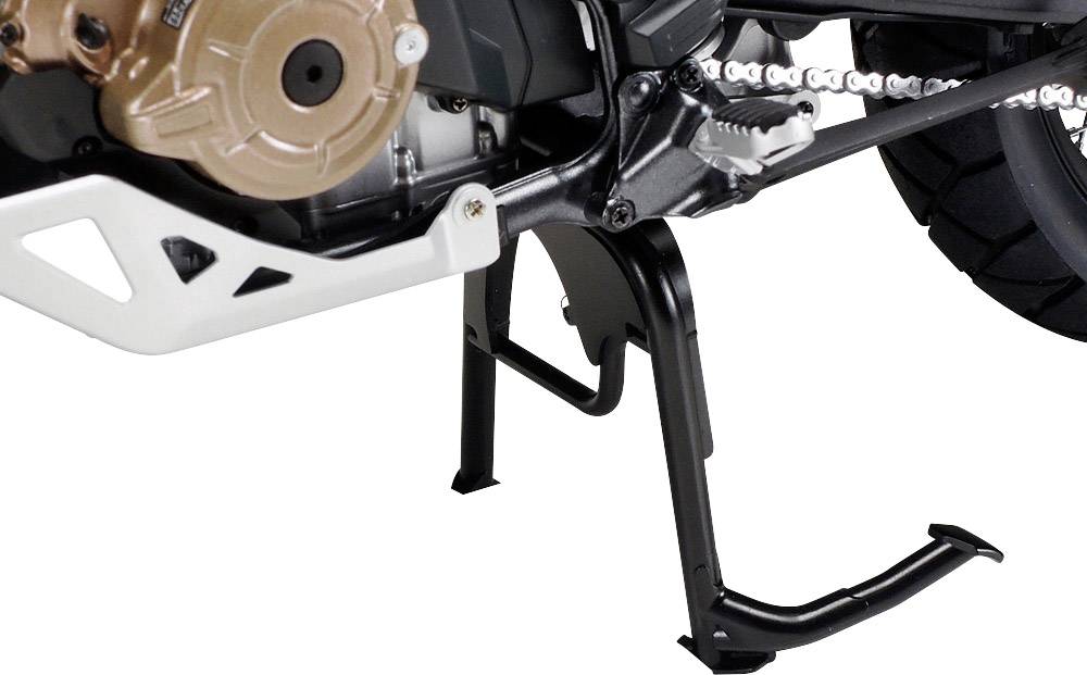 Motorcycle with centre stand deployed, partially visible engine and rear chain.