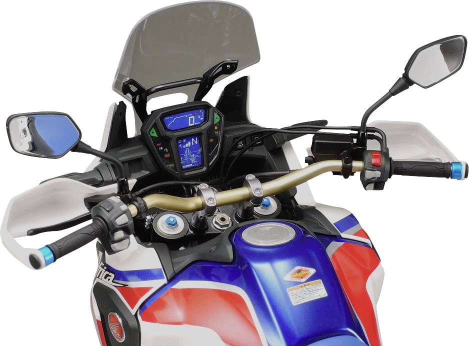 Motorcycle handlebars and dashboard of a sporty motorbike, equipped with modern digital displays and mirrors.