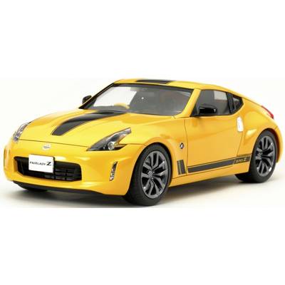 A yellow sports car, front view, with black stripes and a sporty design.