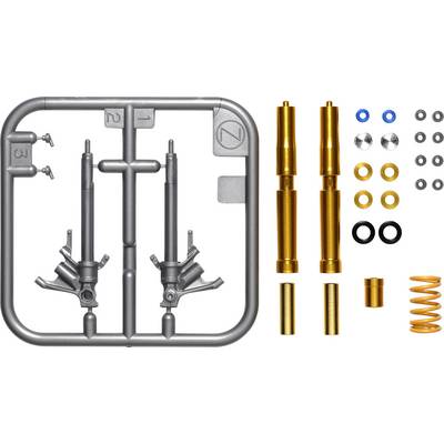 Components of a model kit: grey frames with two parts, along with golden cylinders, springs, and various rings.