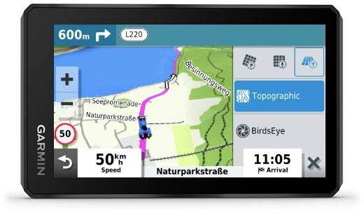 Navigation device shows route on map. Destination in 600 m via L220. Time 11:05. Speed 50 km/h. Topographical view.